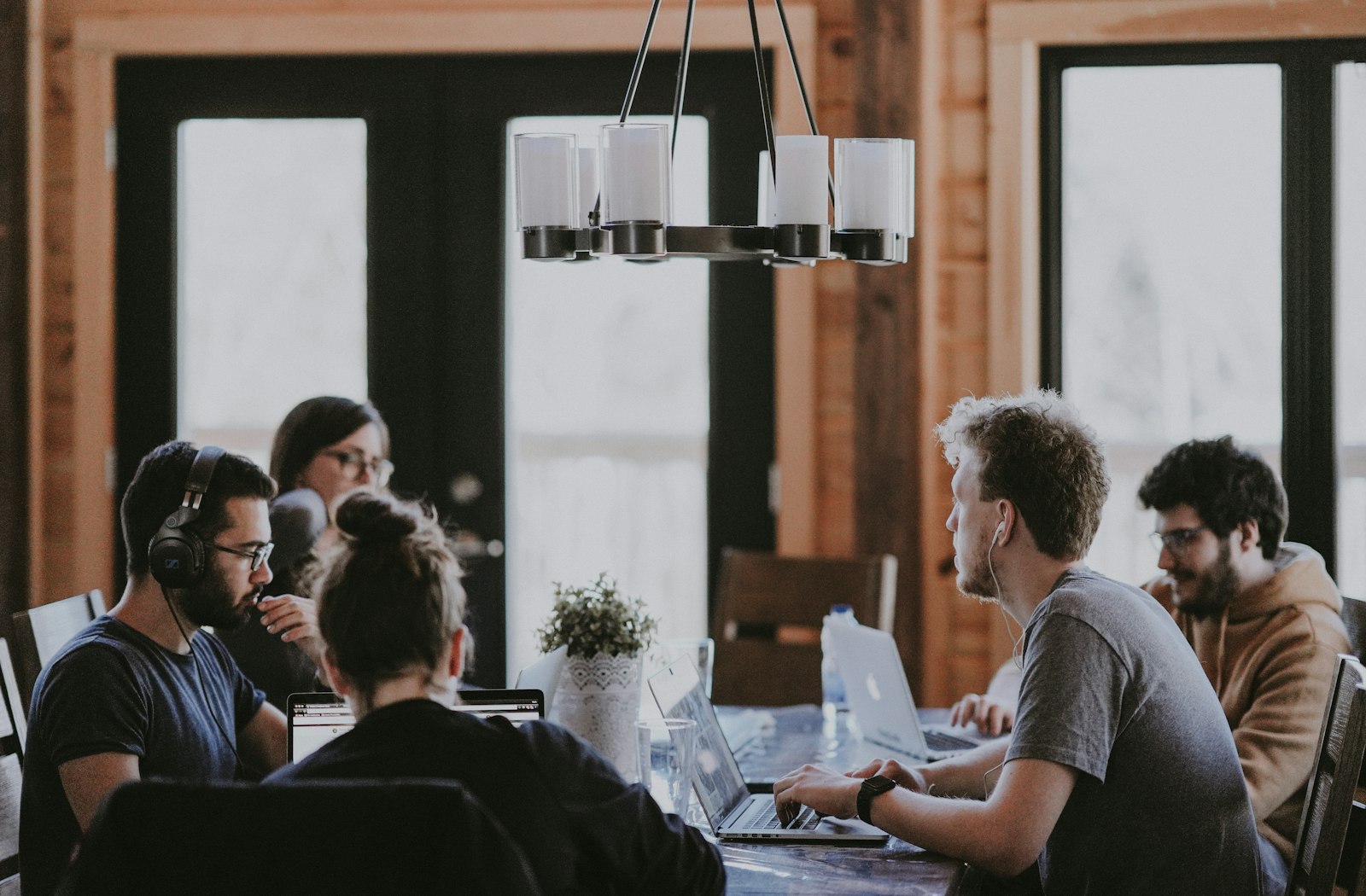 Construction software team collaborating at a shared table