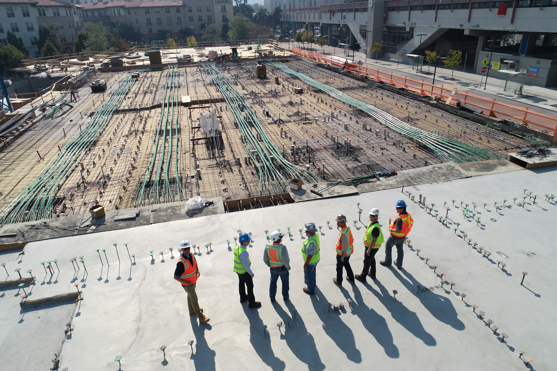 Construction crew coordinating on-site from an aerial view